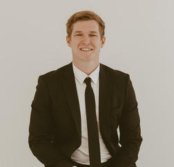 Portrait of Evan Cochlin, Associate.